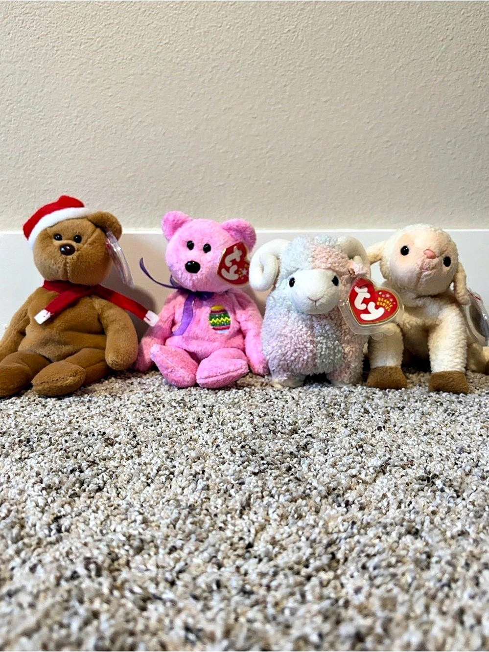 Lot of four Ty Beanie Babies-1997 Teddy, 2000 Eggs, 1999 Ewey, 2002 Bam